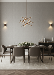 Modern dining room with a geometric pendant light, gray chairs, and a wooden table.
