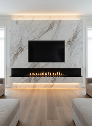 Modern living room with a marble wall, TV, and electric fireplace.