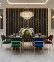 Elegant dining room with marble wall, chandelier, and colorful chairs.