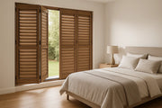 Bi-fold Aluminium Shutters in Timber look colour in bedroom 
