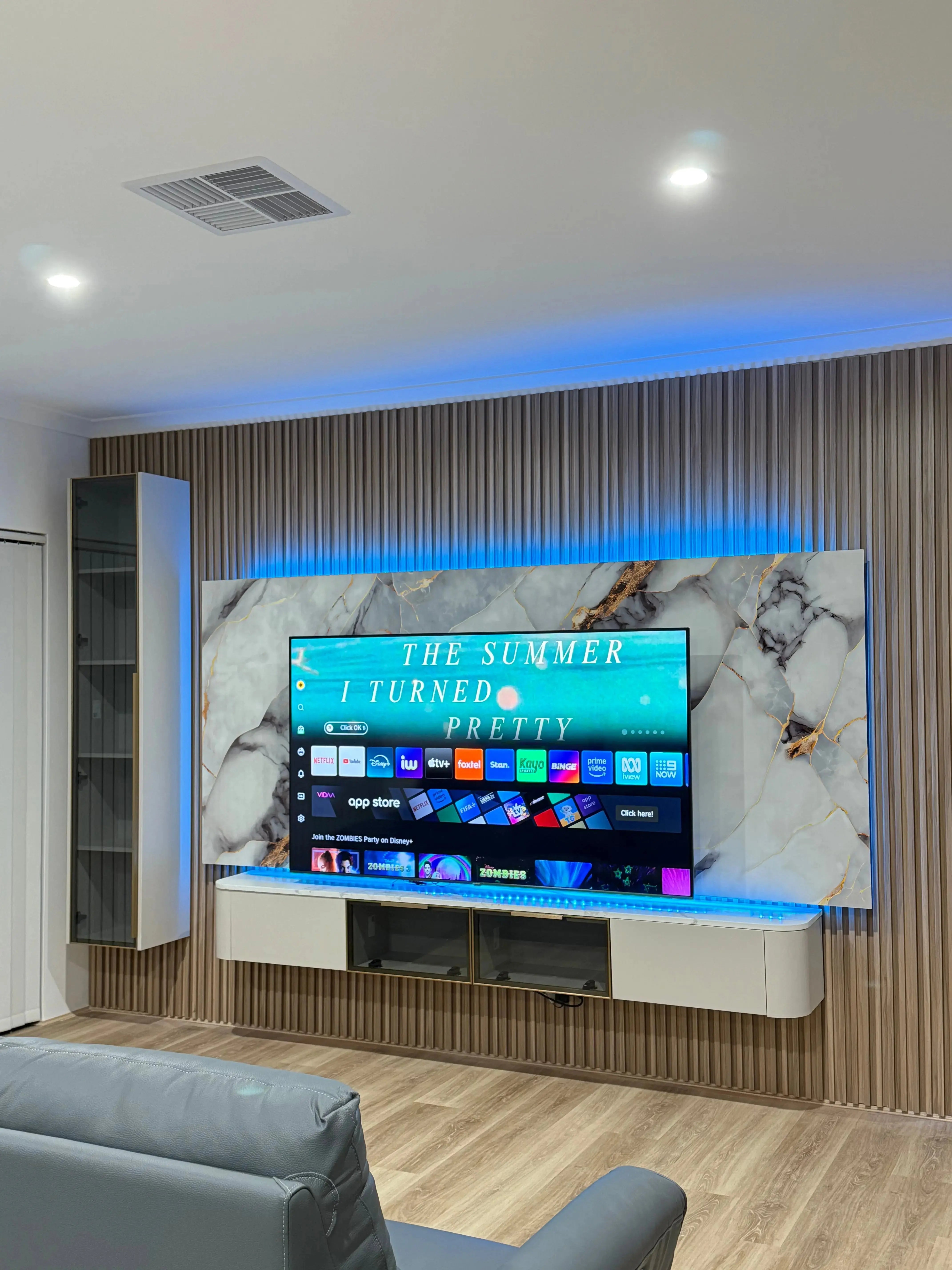 Pearl White floating TV unit by LUXWORLD with glass display cabinet and sleek modern design.
