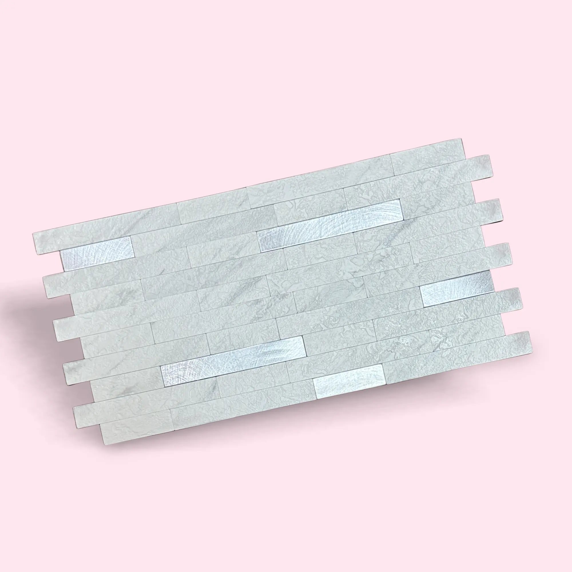 Luxworld peel stick mosaic tile in gold, showcasing a close-up of the decorative mosaic pattern on a white background.