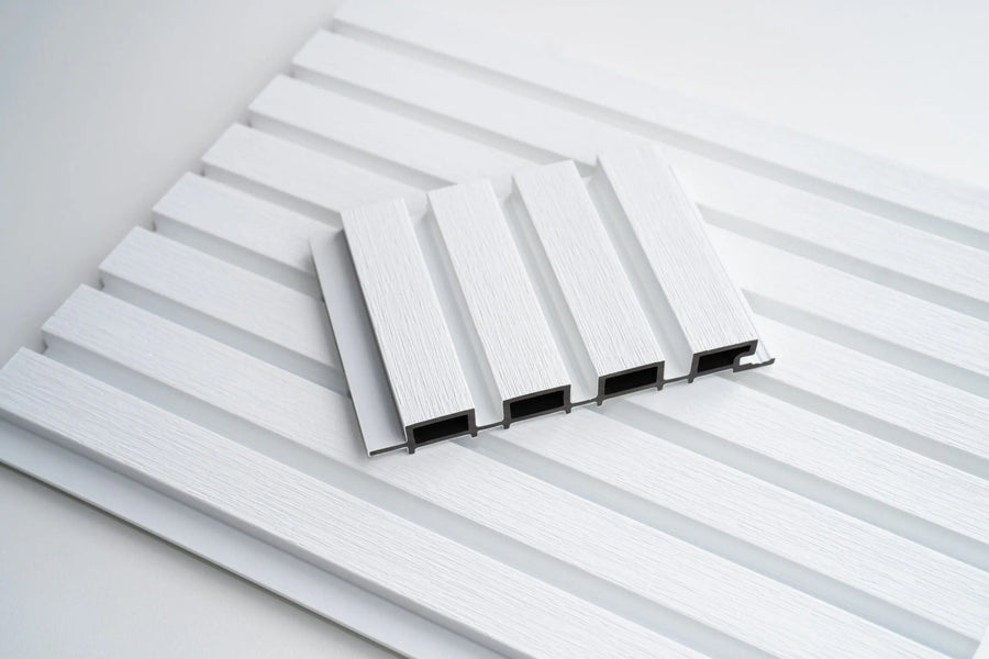 White WPC outdoor wall cladding panel by LUXWORLD, weatherproof exterior wall cladding for durable outdoor surfaces.