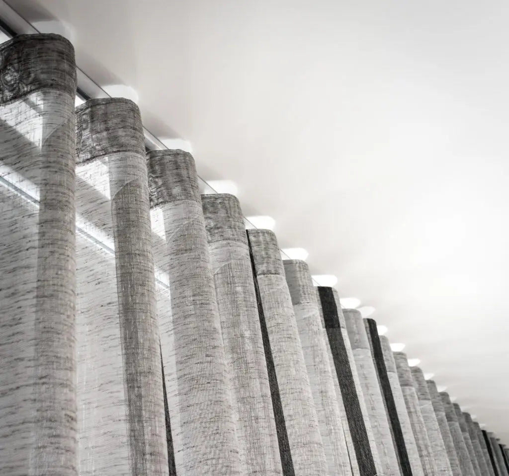 LUXWORLD Series 58 Slimline Curtain Track for curtains and drapes, sleek and modern design, mounted on a wall.