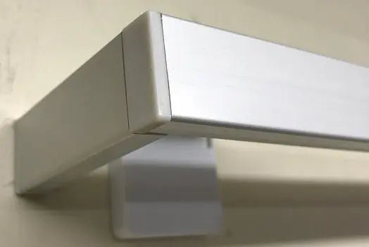 LUXWORLD Series 74 Venice curtain tracking system with metal rails and hanging brackets for elegant window drapery setup.