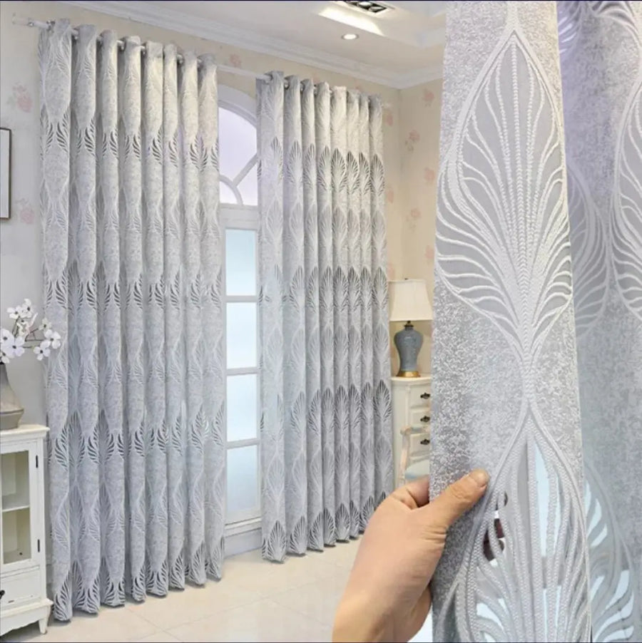 Light grey luxury high-quality curtain from THE-LUXWORLD, showcasing its elegant fabric and full length for modern window decor.
